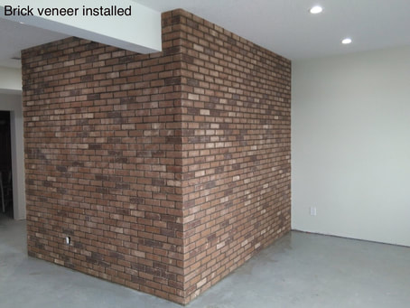 Brick veneer installed on the corner of a wall