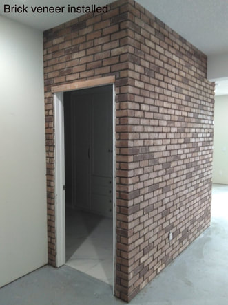 Brick veneer installed around a doorway