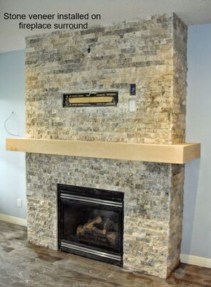 stone installed around a fireplace surround